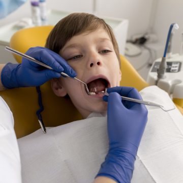 dentist-cleaning-child-s-teeth